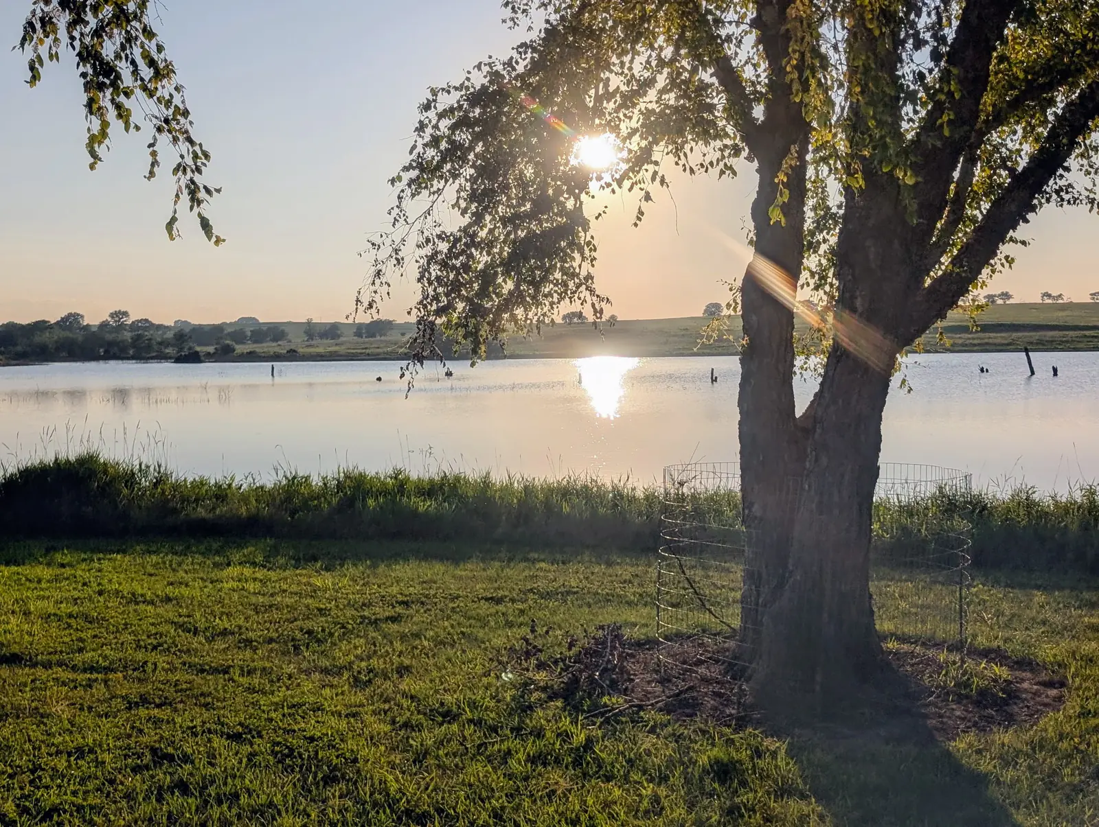 Sunset over the Wirth Brothers farm pond in Johnson County, Nebraska